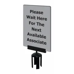 Gray acrylic sign for post tops displaying 'Please Wait Here For The Next Available Associate.' Includes mounting adapter for use with Tensabarrier Posts. Suitable for directing customer flow in retail, hospitality, or service environments.