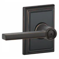This SCHLAGE privacy lever lockset is designed for interior doors requiring locking privacy, such as bathrooms or bedrooms. It features an Addison style lever in an Aged Bronze and Brass finish. The lockset is non-ADA-compliant and non-ligature-resistant, with ANSI function code F76 and no visual indicator message