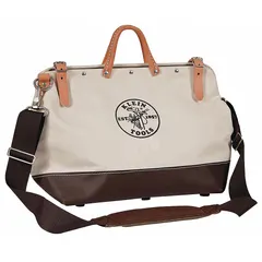 This canvas wide-mouth tool bag in brown features 13 inside pockets for organizing hand tools, test instruments, and small parts. The bag measures 16 inches wide by 6 inches deep by 12 inches high. Suitable for carrying tools on job sites for maintenance, installation, and repair tasks.