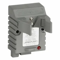 This charger base accepts 120/100 V AC and 12V DC input to power and recharge compatible portable lighting equipment. It is intended for use in industrial, maintenance, and emergency response settings where reliable handheld lighting is required.