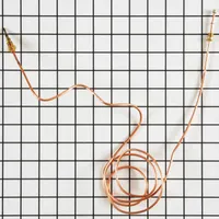 This GE thermocouple is an OEM replacement part for gas ovens. It senses oven temperature and generates a voltage signal to regulate the gas valve, ensuring consistent heat during baking and broiling. Direct replacement for compatible GE oven models