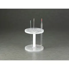 This benchtop pipette holder is made of white polypropylene, offering chemical resistance for laboratory use. It accommodates pipettes in an upright position, with overall dimensions of 2 1/2 inches in height and 7 inches in length. Suitable for organizing pipettes on workbenches during experiments.
