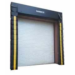 Wood-framed dock seal with 10 in projection depth, fits 9 ft x 9 ft or 8 ft x 8 ft openings. Nylon-reinforced vinyl cover with wear pleats. Seals gap between loading dock and truck to reduce energy loss and prevent dust or pest entry.