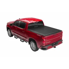 This roll-up tonneau cover is constructed of black vinyl and mounts with a bolt-on design. It measures 85 1/2 inches in length and 6 inches in width. Suitable for protecting truck bed cargo from weather and theft on compatible pickup trucks.