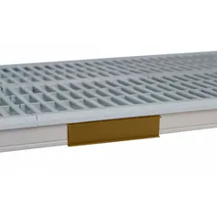 This tan identification marker is designed for use with Metro Super Erecta Pro plastic shelving. It measures 6 inches in overall width and 1 1/2 inches in overall height. Used for labeling and organizing shelf contents in storage areas.