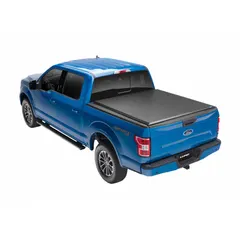This roll-up tonneau cover is constructed of black vinyl and measures 78 inches in length by 6 inches in width. It features a bolt-on mounting design for secure attachment to pickup truck beds, providing protection for cargo against weather and theft.