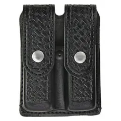 This duty equipment pouch is constructed from black synthetic leather with a basket weave finish. It measures 5 3/4 inches by 1 5/16 inches and is designed to carry a spare magazine. Typical applications include use by security and tactical personnel for low-profile magazine storage.