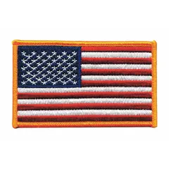 This embroidered emblem features a U.S. Flag design in gold on a plastic base. It measures 4 inches by 2-1/2 inches and is attached by sewing onto fabric. Suitable for uniforms, bags, or apparel to display patriotic affiliation.