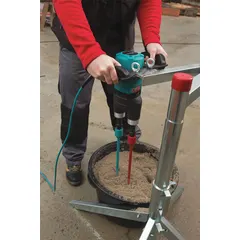 This mixing stand provides a stable platform for concrete mixing operations. It supports the mixer securely, reducing vibration during use. Designed for use with compatible paddle mixers.