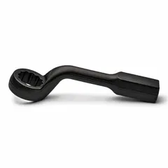 Black-finished steel striking wrench with a 1 7/16 in 12-point box end, 1 in head thickness, and 11 1/2 in overall length. Offset handle design allows access to fasteners in confined spaces. Used for heavy-duty bolting applications where high torque is applied via hammer blows on the striking face.