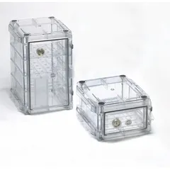 This rectangular vacuum desiccator is constructed of polyester for corrosion resistance and lightweight handling. It includes a lid and three shelves, with a capacity of 1.9 cubic feet and an overall width of 13 3/8 inches. Used in laboratory settings to store moisture-sensitive materials under low-pressure conditions.