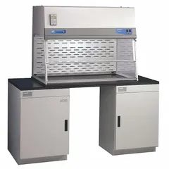 This 6 ft wide, 46 1/4 in high filtered enclosure is designed for use with balances, bulk powder handling, and equipment. It is supplied unassembled and includes a blower; a base/stand and work surface are required but not included. Typical applications include weighing and powder transfer operations requiring containment of airborne particulates.