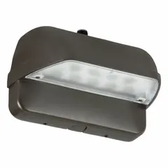 LED wall pack with anti-glare design, delivering 1989 lumens at 4000K neutral white light. Operates on 120-277V AC, consumes 22W, and features Type III distribution for area lighting. Bronze housing, overall height 5-1/4 in. Suitable for perimeter illumination of building exteriors, entrances, and walkways.