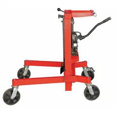 This palletizing drum truck is designed for handling 55 gal metal drums. It features a spring-loaded clamp that secures the drum during transport. The body is finished in red. Typical applications include moving and palletizing drums in warehouses and industrial facilities.